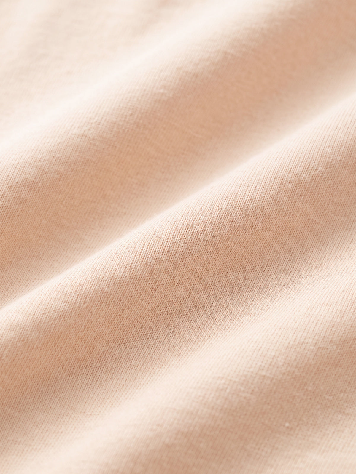 Naadloze Brief, close-up van de apricot stof